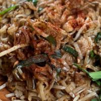 Pad Thai · Stir-fry rice noodles in tamarind sauce, egg, bean sprouts, and chinese chives. Garnished wi...