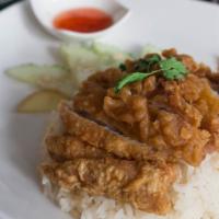 Khao Mun Gai Tod · Deep fried chicken thigh, fragrant rice, winter melon soup, sweet chili sauce.