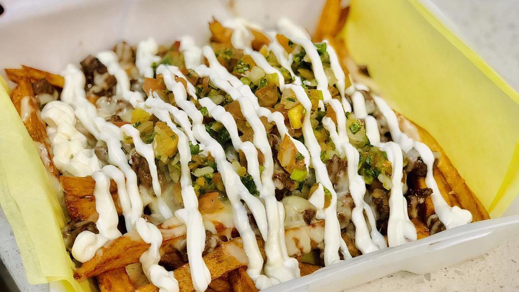 Carne Asada Fries · Awesome dish turned into a house favorite.