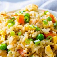 Chicken Fried Rice · Steamed rice stir fried with eggs, peas, carrots and green onion.