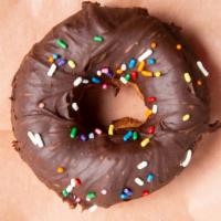 Chocolate Dipped (Vegan) · Vegan Vanilla Cake Donut dipped in a Vegan Chocolate Glaze and topped with Vegan sprinkles.