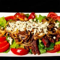 Ny Steak Salad · Charbroiled NY Steak sliced and set over mixed greens with tomato, onions. Steak is topped w...