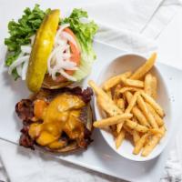Bacon Cheeseburger* · Our signature sirloin patty topped with two strips of bacon, cheddar cheese, lettuce, tomato...