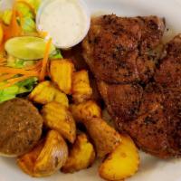 Lamb Steak (14 Oz.) · Lamb boneless  marinated in-house spices, roast potatoes or Cranberry rice, steak sauce, sal...