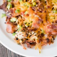 Loaded Hash · Our Red & White quinoa hashbrown, Local Cheddar Cheese, Crumbled Daily's Bacon, Fresh Organi...