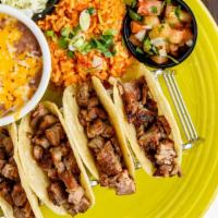 Street Tacos · Cooked to order. Four miniature soft grilled steak*, chicken or carnitas tacos. Served with ...