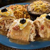 #7 Chili Relleno Dinner · A roasted green chili stuffed with Monterey jack cheese, wrapped in an omelet and covered wi...