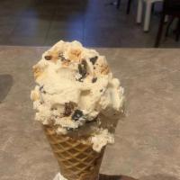 Ice Cream Waffle Cone · Waffle cone served with a scoop of ice cream of your choice: chocolate, vanilla, cookies and...