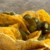 Large Nacho Plate · Large portion of nacho chips served with nacho cheese and topped with jalapenos.