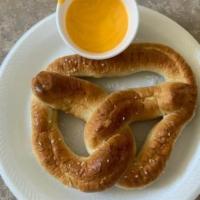 Pretzel With Nacho Cheese · Your choice of a steaming hot pretzel with nacho cheese or cinnamon sugar.