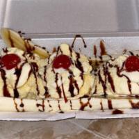 Banana Split · Banana splits served with three scoops of ice cream; strawberry, vanilla or chocolate. Two b...