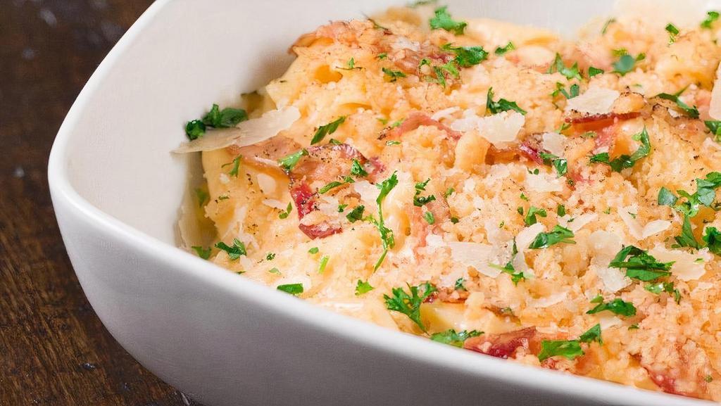 Family Get Back Mac & Cheese · Bacon, Cheddar cheese, Jack cheese, Romano cheese, Mozzarella, penne rigate pasta, cream sauce, parsley, crumbled crouton topping.   Family sized.  Serves 4