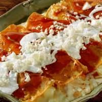 Cheese Enchiladas · Three corn tortillas stuffed with cheese and topped with your choice of sauce. Served with r...