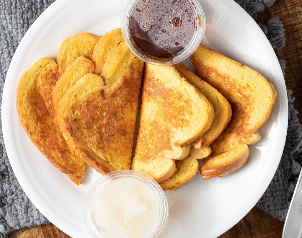 Sourdough French Toast · Slices of sourdough bread dipped in our egg batter, sprinkled with powdered sugar, and grilled to perfection.