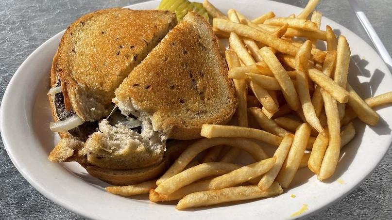 Patty Melt · A patty topped with melted american cheese and sautéed onions, on griled rye