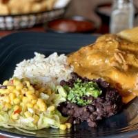 Tamale · 2 pork tamales and mean green chile. served with black beans and cilantro lime rice. lettuce...