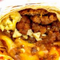 Fiesta Breakfast Burrito  · cage free eggs, paprika potatoes, ground sausage, cheddar cheese, sour cream and pico del ga...