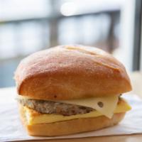 Sausage Breakfast Sandwich · Nitrate free sausage patty, sharp white cheddar and a cage free egg toasted on ciabatta with...