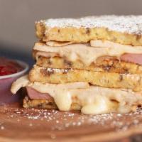 Monte Cristo · Cinnamon french toast sandwich with Ham, Turkey and Havarti cheese