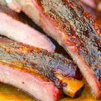 Jerk Smoked Ribs Plate · Slow-smoked & finished on the grill, seasoned w/ house jerk.