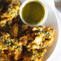 Vegetable Pakora · A variety of vegetables, chickpea battered and deep fried.