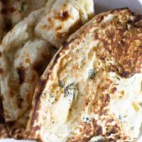 Plain Naan · Plain white flour flatbread cooked in our tandoor oven.