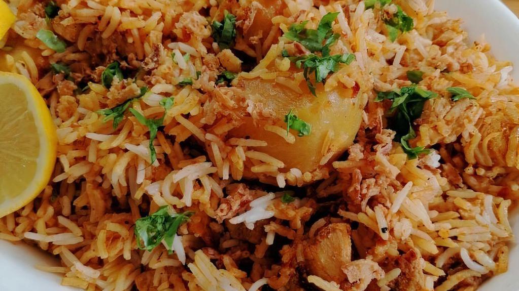 Chicken Biryani · Cooked with pilau rice.