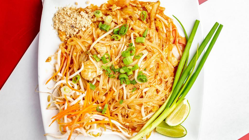 Pad Thai · Stir-fried rice noodles with eggs, bean sprouts, carrots, & green onions, topped with crushed peanuts.