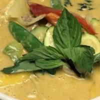 Yellow Curry · Yellow curry paste with coconut milk, bamboo shoots, onions, carrots, and potatoes.
