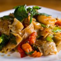 P2 - Pad Kee Mao · Flat rice noodles with yellow onions carrots green and red bell peppers broccoli chilies bas...