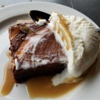 Black And Tan Brownie · Served warm with caram-ale sauce, almond whipped cream.