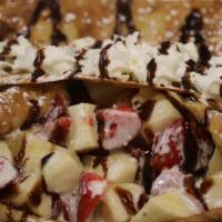 Crepes, Banana Strawberry & Nutella · Made with fresh banana , strawberries, Nutella covered with delicious sweet cream and whippe...