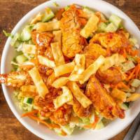 Asian Crispy Chicken Salad · Shredded lettuce, sweet chili tossed crispy chicken, sliced cucumbers, matchstick carrots, a...