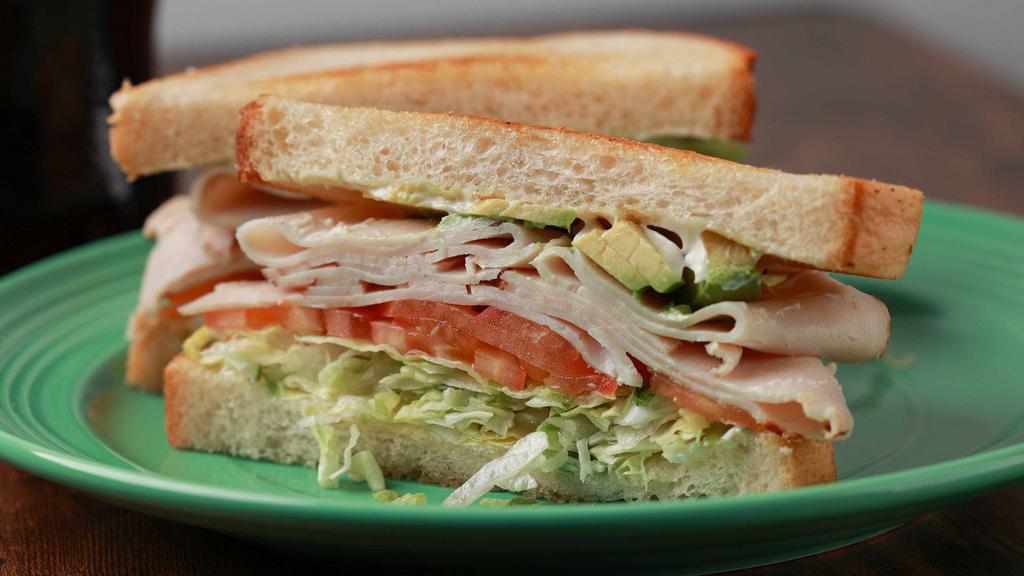 Philly Bird Sandwich · Turkey, avocado, white American cheese, lettuce, tomato, mayo on sourdough bread.