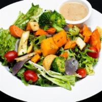 House Salad · House salad spring mix, roasted seasonal vegetables, tomatoes, and vinaigrette.