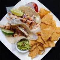 Fish Tacos · Fish tacos choice of panko breaded and fried or chargrilled mahi-mahi topped with cranberry ...