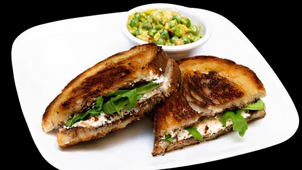 Grilled Fig & Goat Cheese · Fig, goat cheese and arugula on rustic white.