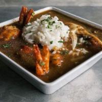 Gumbo · Chicken, beef hot links, shrimp & okra in a dark roux w/ white rice