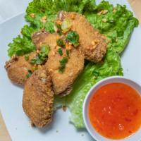 Chicken Wings · Spices rubbed and seasoned, deep fried, serve with house chili special sauce