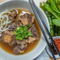 Oxtail Pho · Braised beef broth & gluten-free rice noodles with oxtail, green onion, cilantro, white onio...