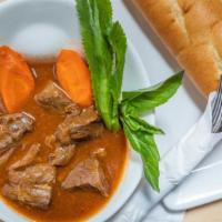 Old Town Beef Stew · Slow braised beef shank & carrots in velvet beef broth; served with egg noodles or French br...