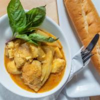 Curry Chicken · Rich yellow curry, coconut milk, sweet potatoes, white onion; served with Jasmine rice or Fr...