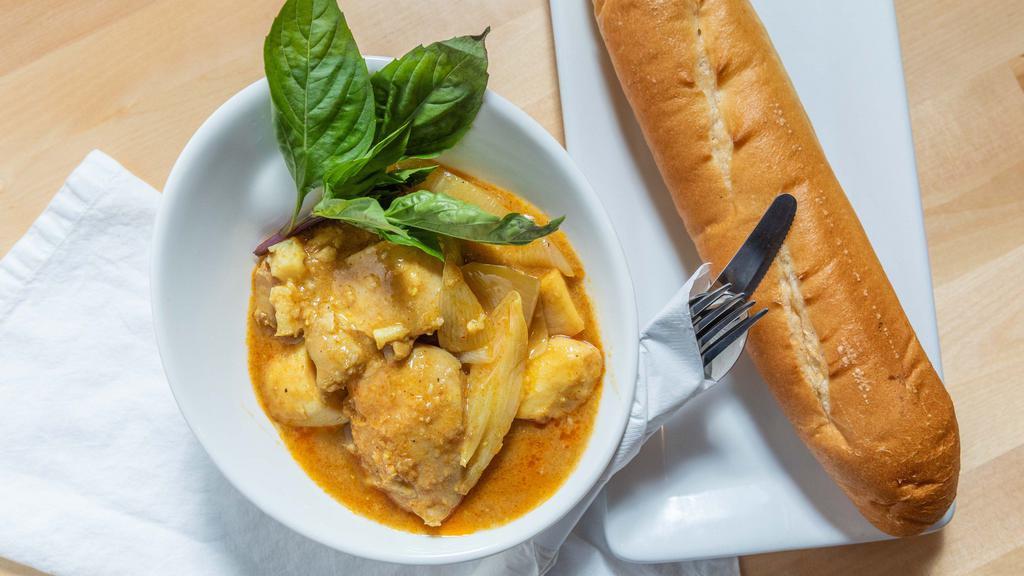 Curry Chicken · Rich yellow curry, coconut milk, sweet potatoes, white onion; served with Jasmine rice or French Bread