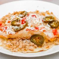 Gringa  Or  Quesadilla · Two flour tortillas grilled and filled with mozzarella cheese and your choice of veggies or ...