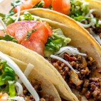 Taco Plate · Three tacos with corn tortillas layered with mozzarella cheese and your choice of veggies or...