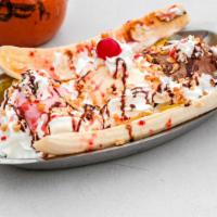 Banana Split · 2 banana slices served with 3 ice cream scoops and topped with whip cream, strawberry, choco...