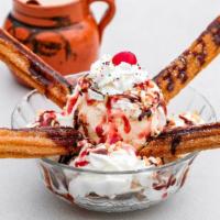 Val Sundae · 2 small churros with one ice cream scoop, topped with whip cream, strawberry, chocolate, and...