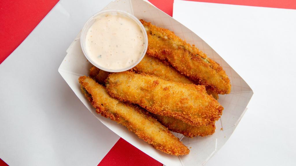 Fried Pickles · Large pickle spears deep fried in our house cajun batter served with our own habanero ranch sauce.