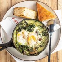 Baked Eggs · Creamy spinach with leeks, mushrooms, house focaccia