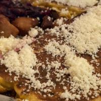 Cardenalito · Steamed or fried yucca, Venezuelan style smoked meat, pork sausage, fried pork, cheese cubes...
